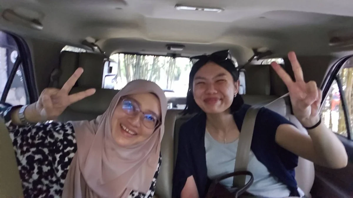 Passengers seated in a private transfer vehicle